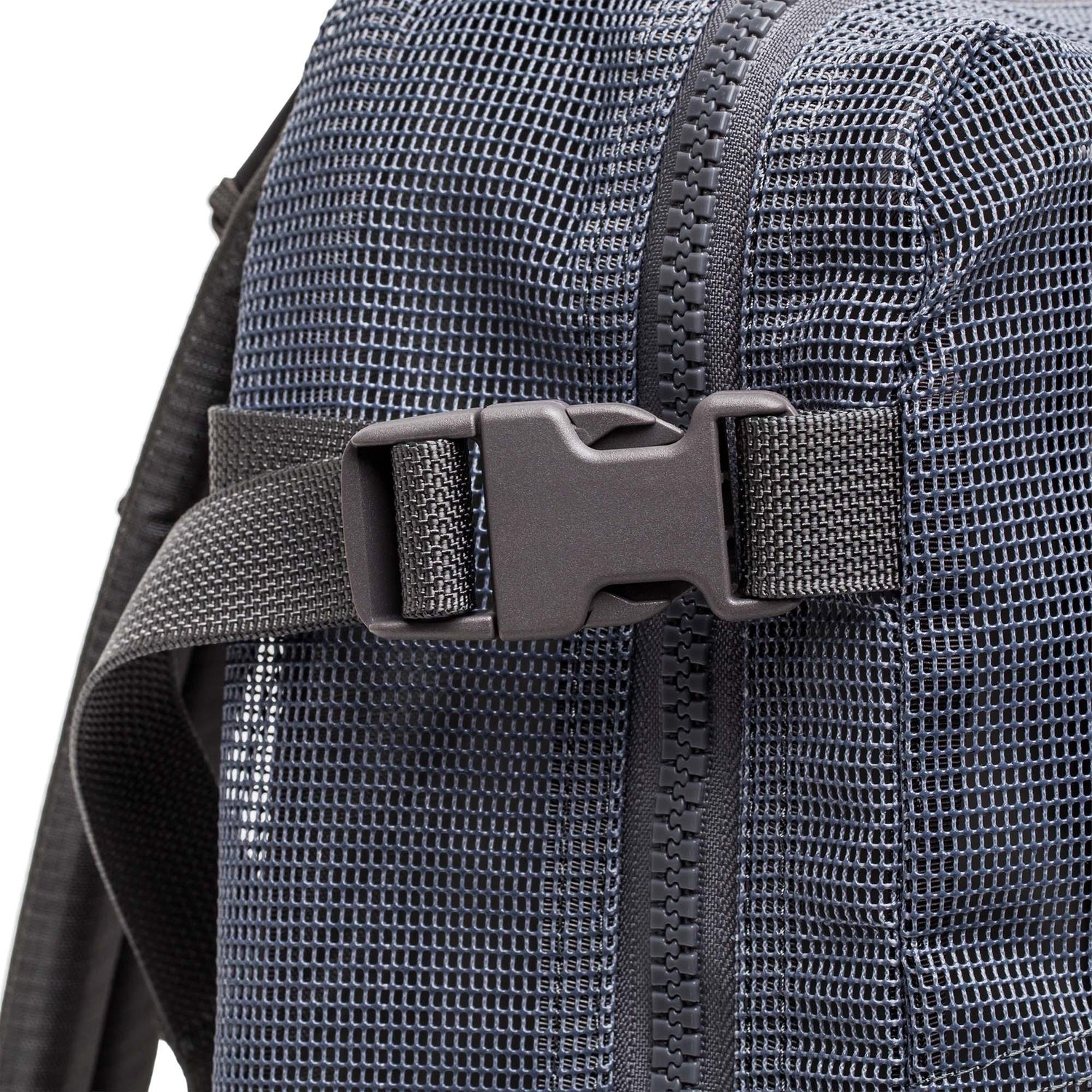 Close-up of the Mesh Ruck, a black mesh backpack featuring a plastic buckle and zipper—ideal as a quick-drying beach bag.