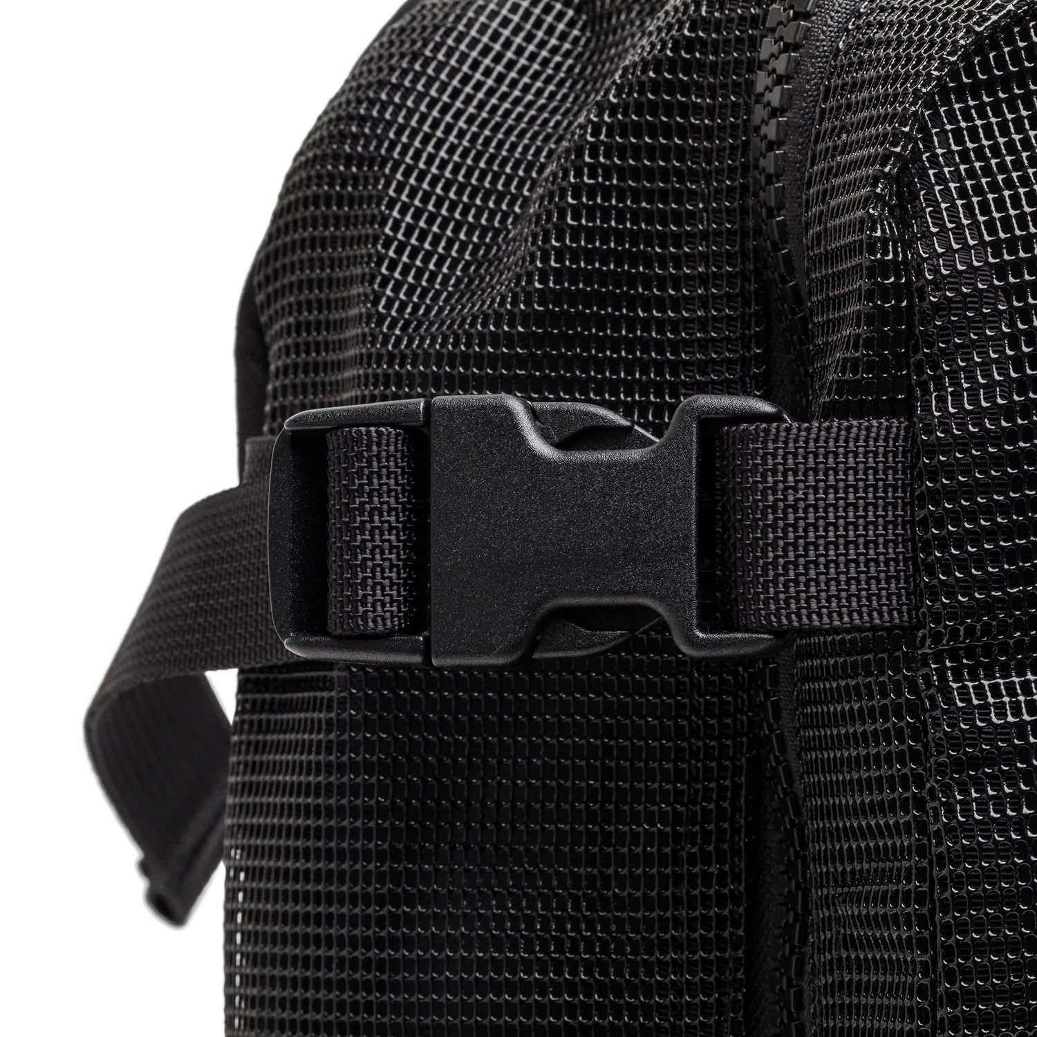Close-up of black mesh fabric backpack strap with plastic buckle and textured rucking gear detail by GORUCK