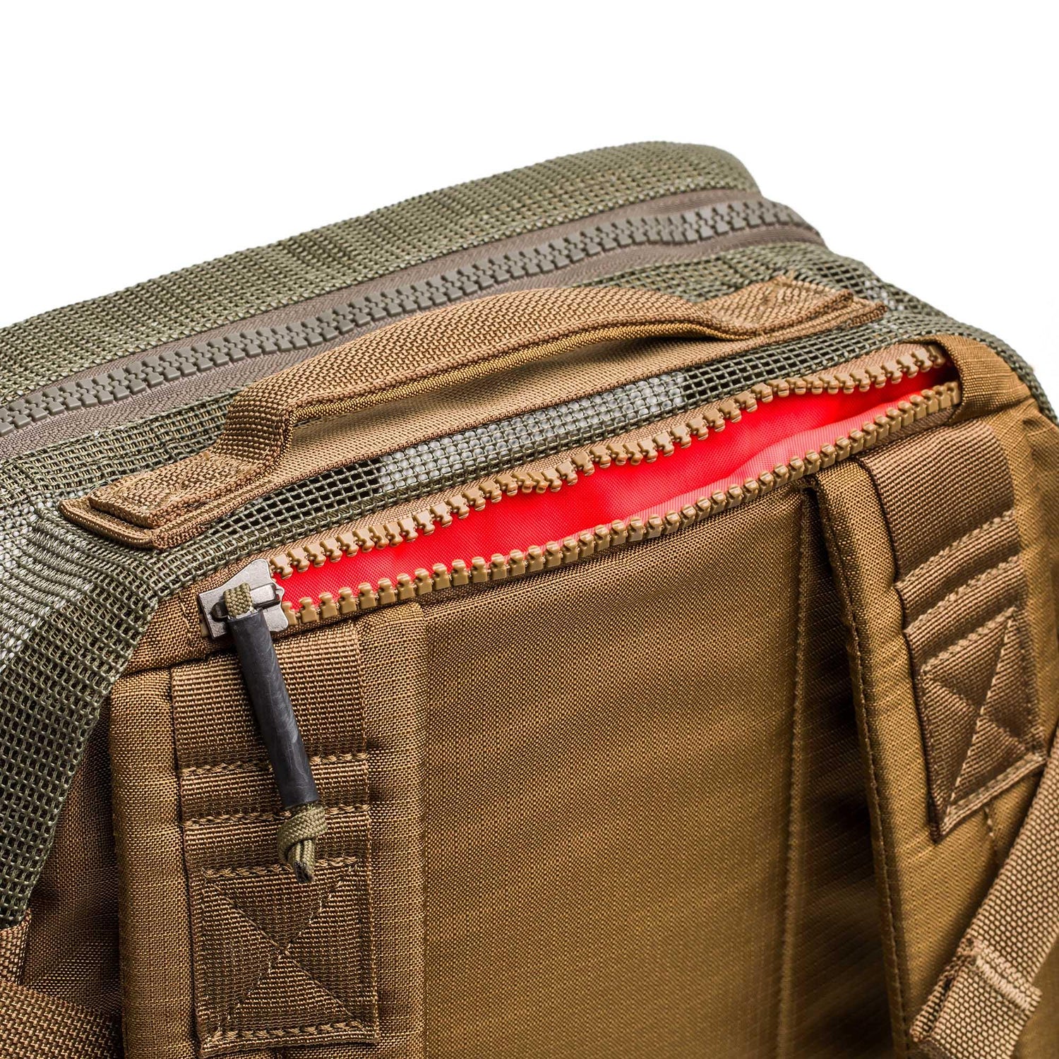 Close-up of the Mesh Ruck, a brown quick-drying backpack, with its zipper partially open to reveal a bright red inner lining.