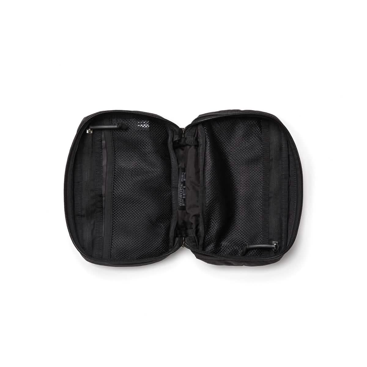 Introducing the GR1 Field Pocket - Dyneema by GORUCK: a sleek black zippered travel case with mesh pockets on each side. This highly organized interior is perfect for storing electronics, travel accessories, or small items, making it an ideal choice for travelers. Constructed from Dyneema material, it's both lightweight and durable against a crisp white background.