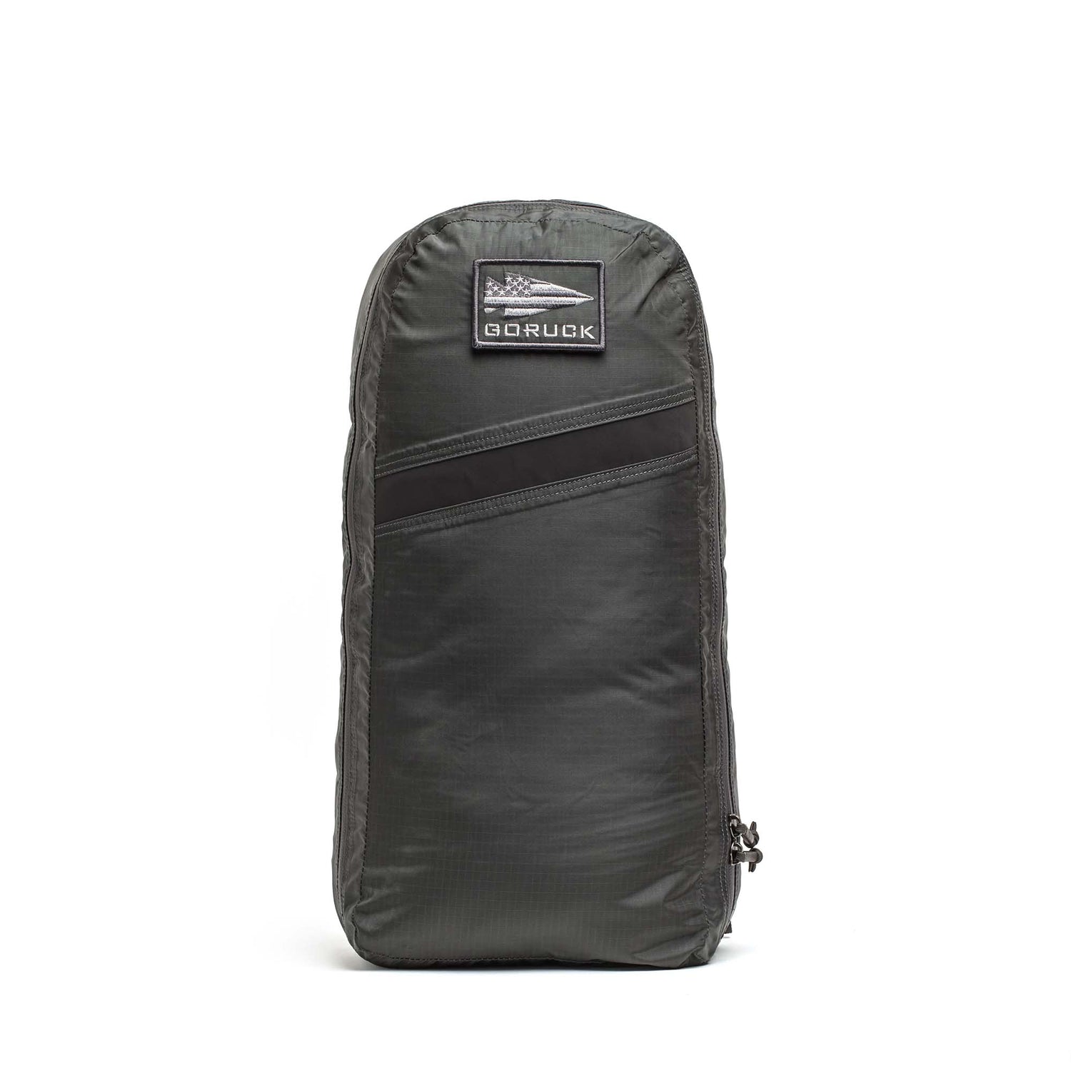 A dark gray Packable Bullet Ruck - Ripstop ROBIC® backpack stands upright, featuring a small front patch, AquaGuard zippers, and a side zipper.