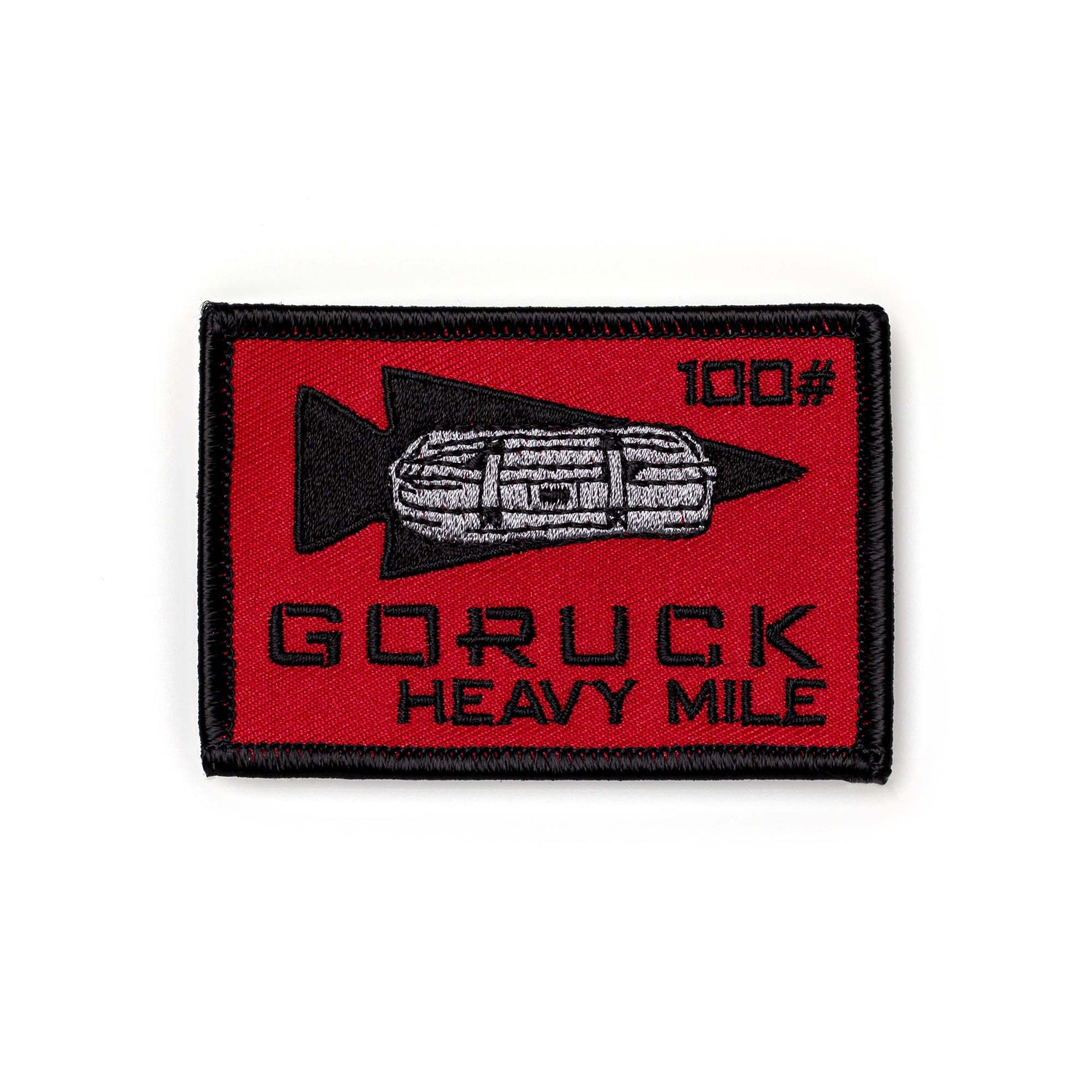The Patch - HEAVY MILE features a red rectangle with a black arrow, sandbag,