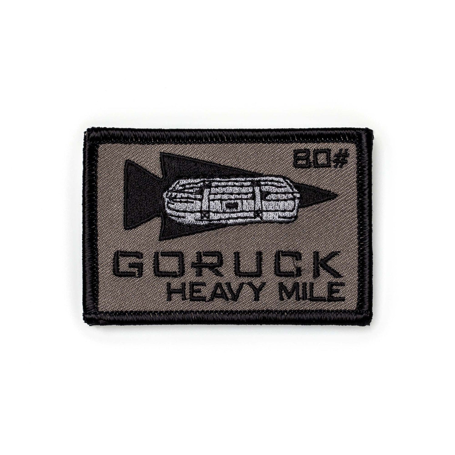 Rectangular Patch - HEAVY MILE with rucksack and arrow design, labeled