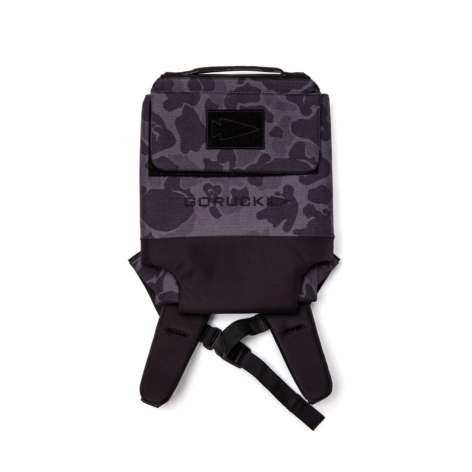 The Ruck Plate Carrier 3.0 is a black and dark grey camo backpack featuring the “GORUCK” logo, a front pocket, padded shoulder straps, and ergonomic lumbar support for enhanced comfort.