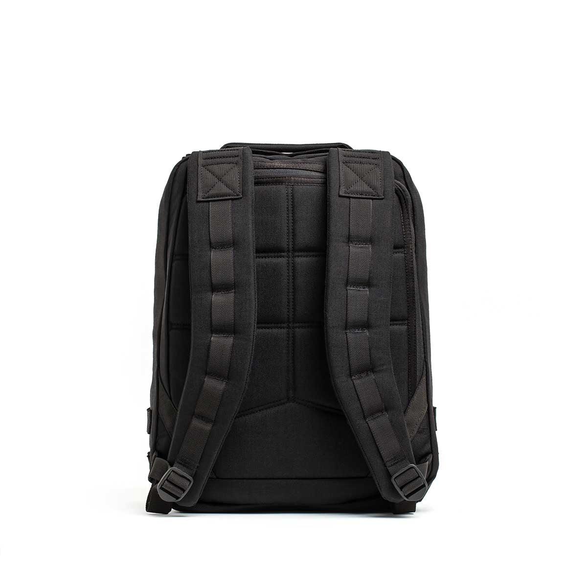 GORUCK Radio Ruck black ballistic backpack with padded straps, rear view on white background