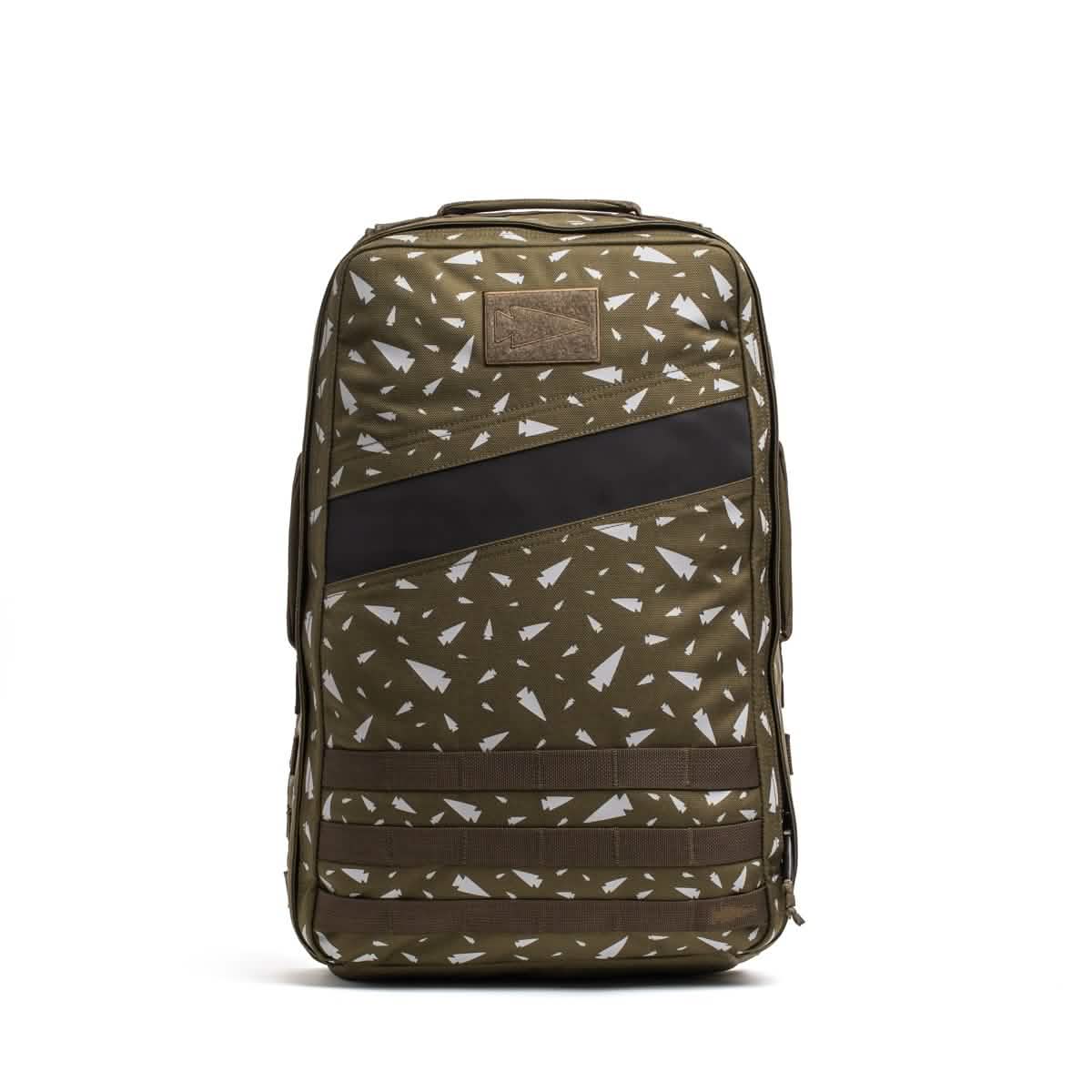 The Rucker 4.0 - Reflective Spearhead is an olive green rucksack with white geometric patterns and a black diagonal stripe, designed for stylish rucking and standing upright on a white background.