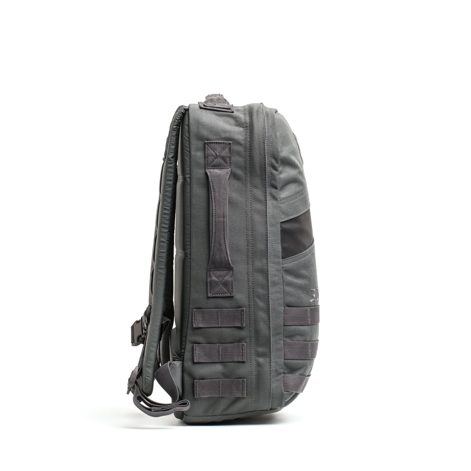 Side view of a durable GORUCK 20L rucksack in armor grey with orange interior and heavy-duty straps