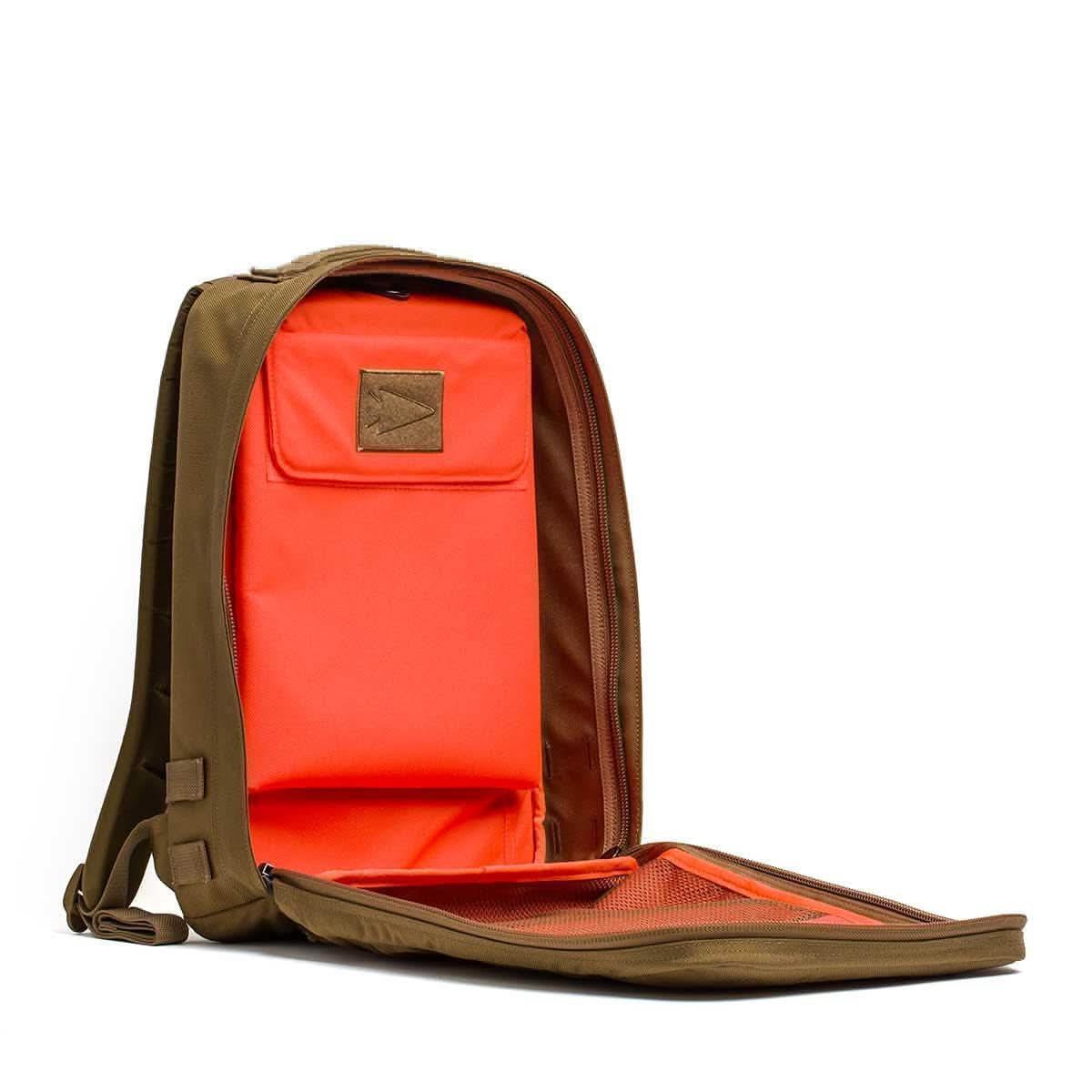 GORUCK Rucker 4.0 15L coyote brown rucksack opened showing bright orange interior and mesh pocket