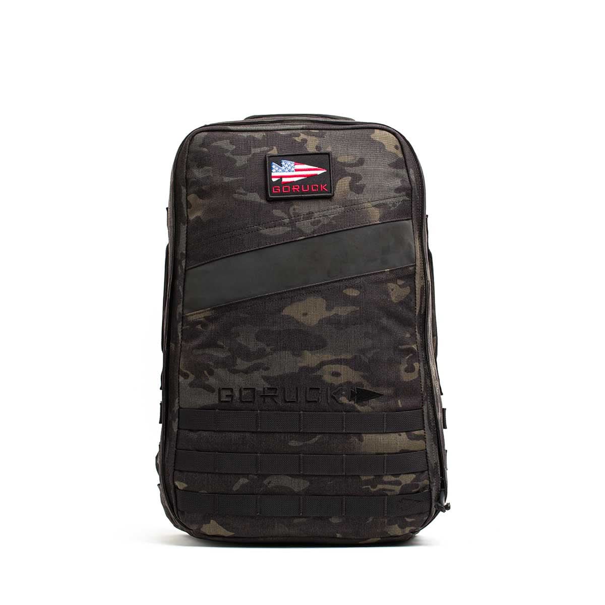 A black camo GORUCK Rucker 4.0 rucksack featuring a front patch with the American flag.