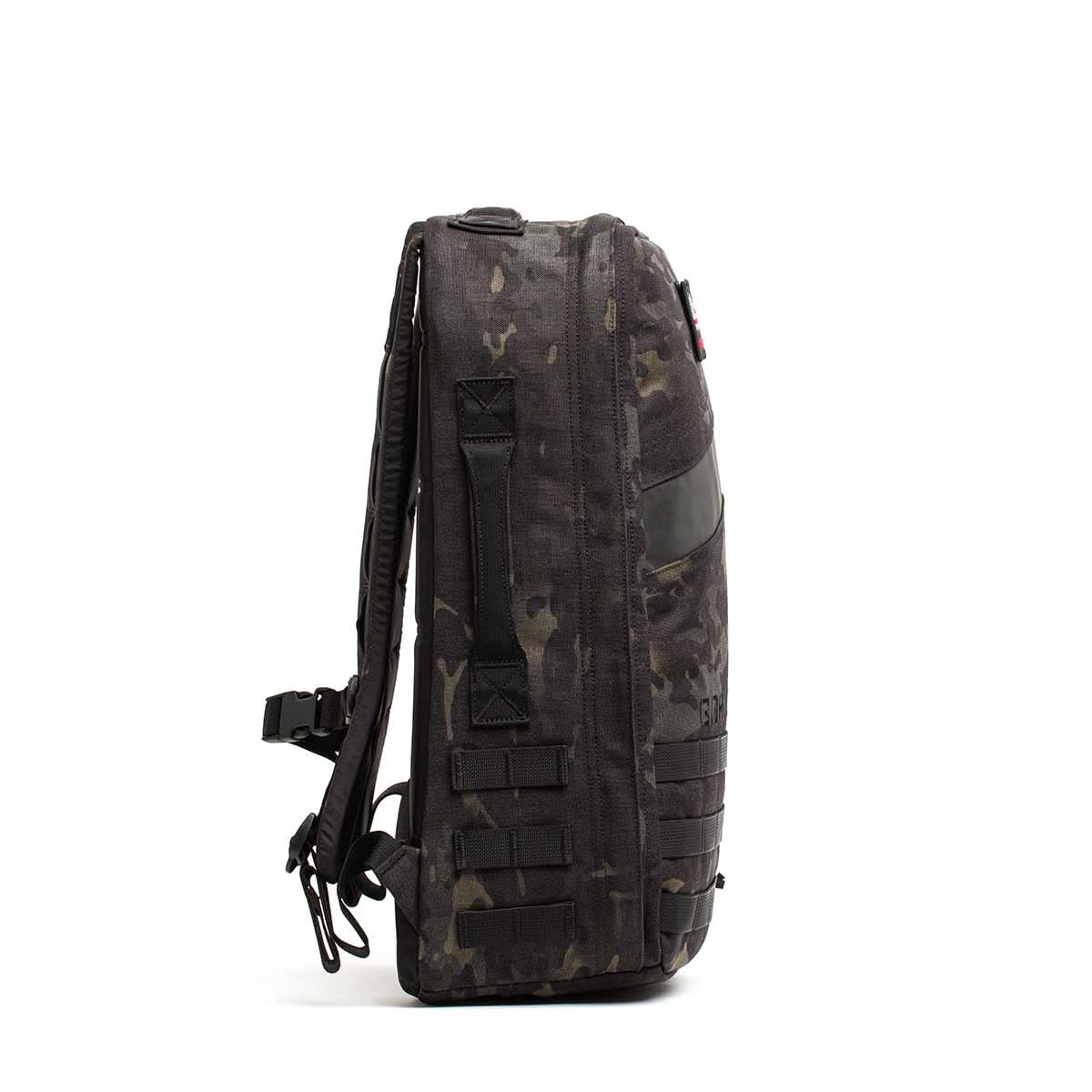Side view of a black camouflage Rucker 4.0 backpack featuring multiple straps and a handle, designed for rucking and carrying Ruck Plates, shown against a white background.
