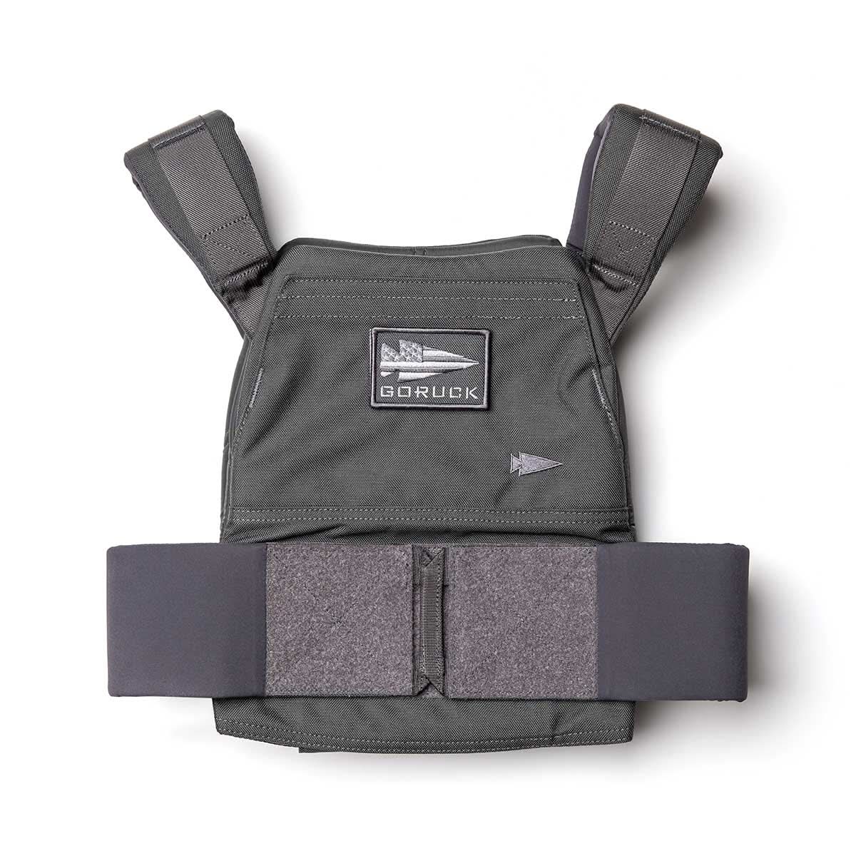 The Rucking Weight Vest is a black tactical vest with padded straps and a GORUCK patch, designed for rucking and compatible with Curved Ruck Plates, shown on a white background.