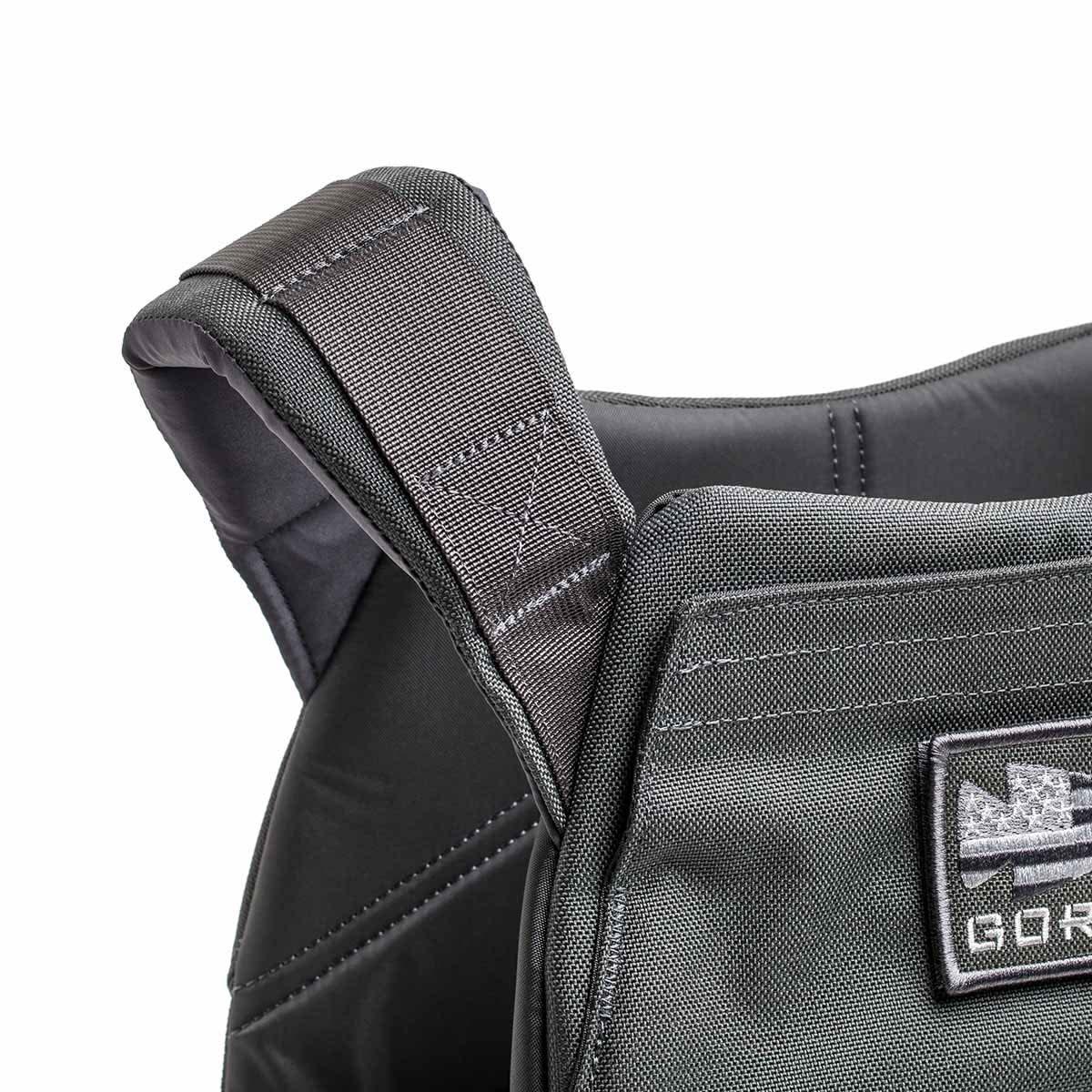 GORUCK grey rucking weight vest close-up showing durable padded straps and front patch