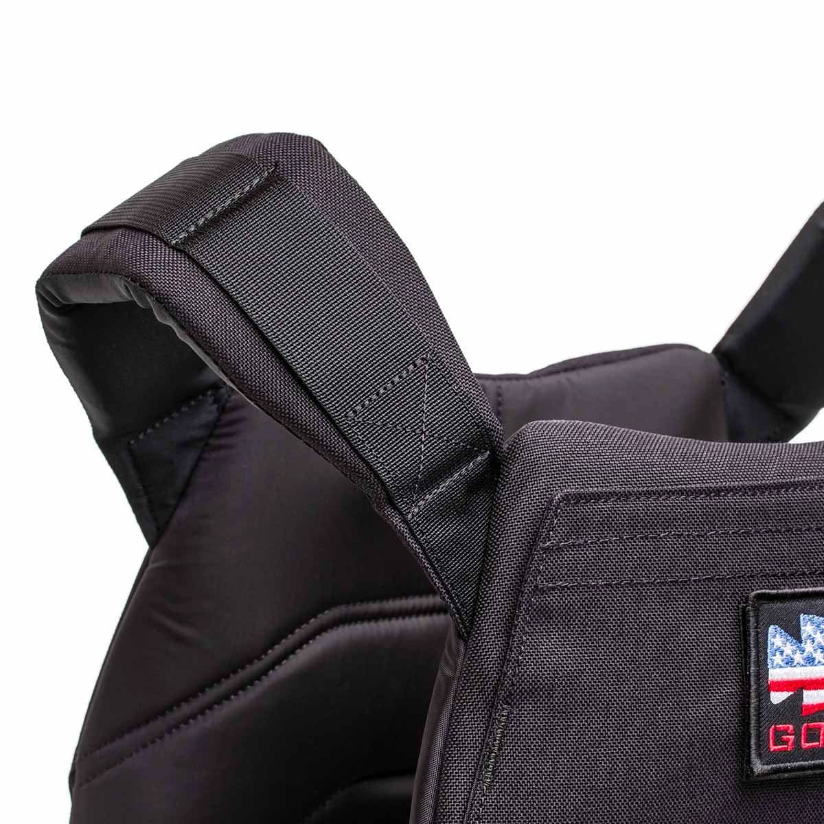 Close-up of the Rucking Weight Vest in black with visible stitching and a small American flag patch on the front, designed for rucking and compatible with Curved Ruck Plates.