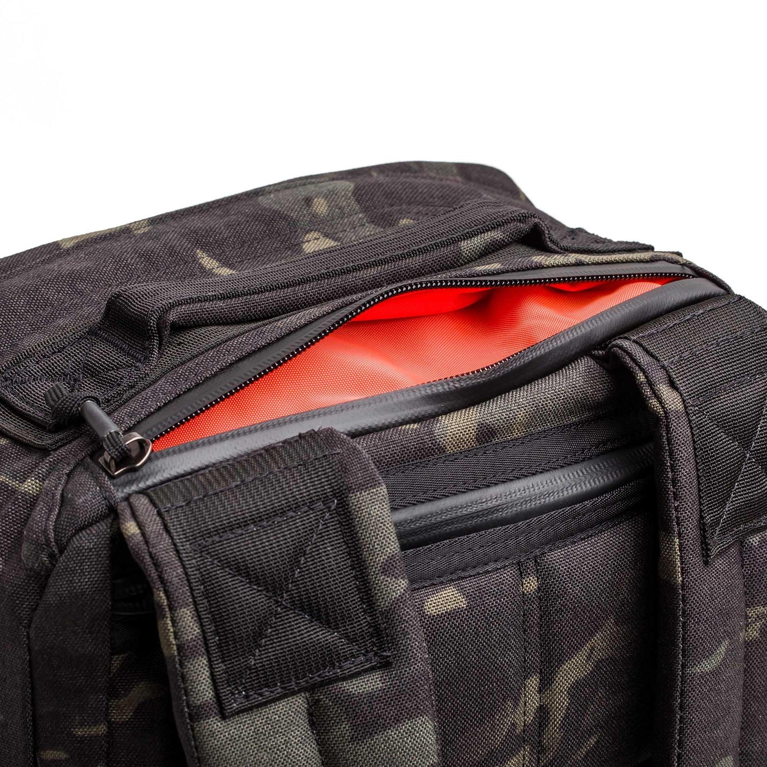 GORUCK black Multicam rucking gear bag with open zipper showing orange interior