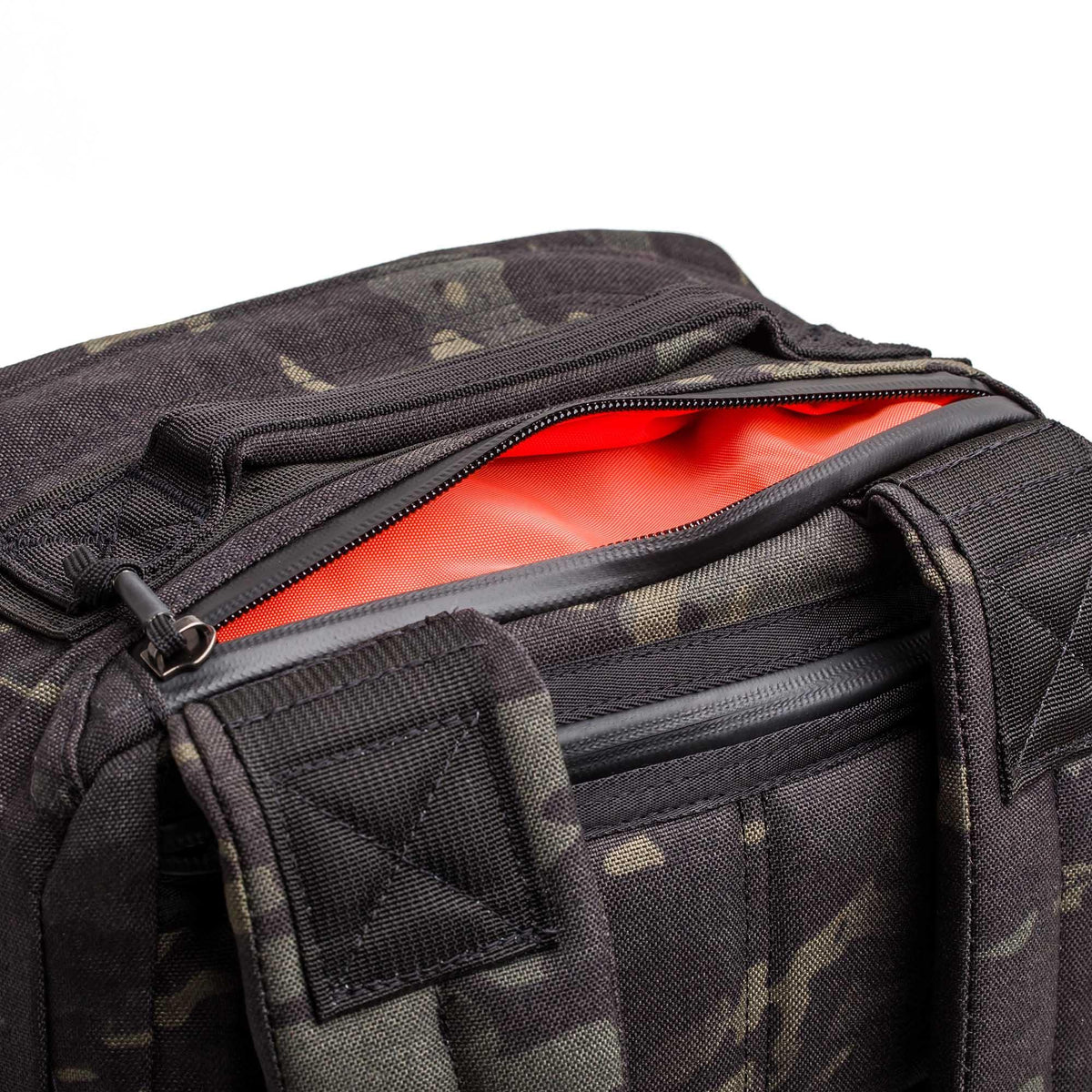 GORUCK black Multicam rucking gear bag with open zipper showing orange interior
