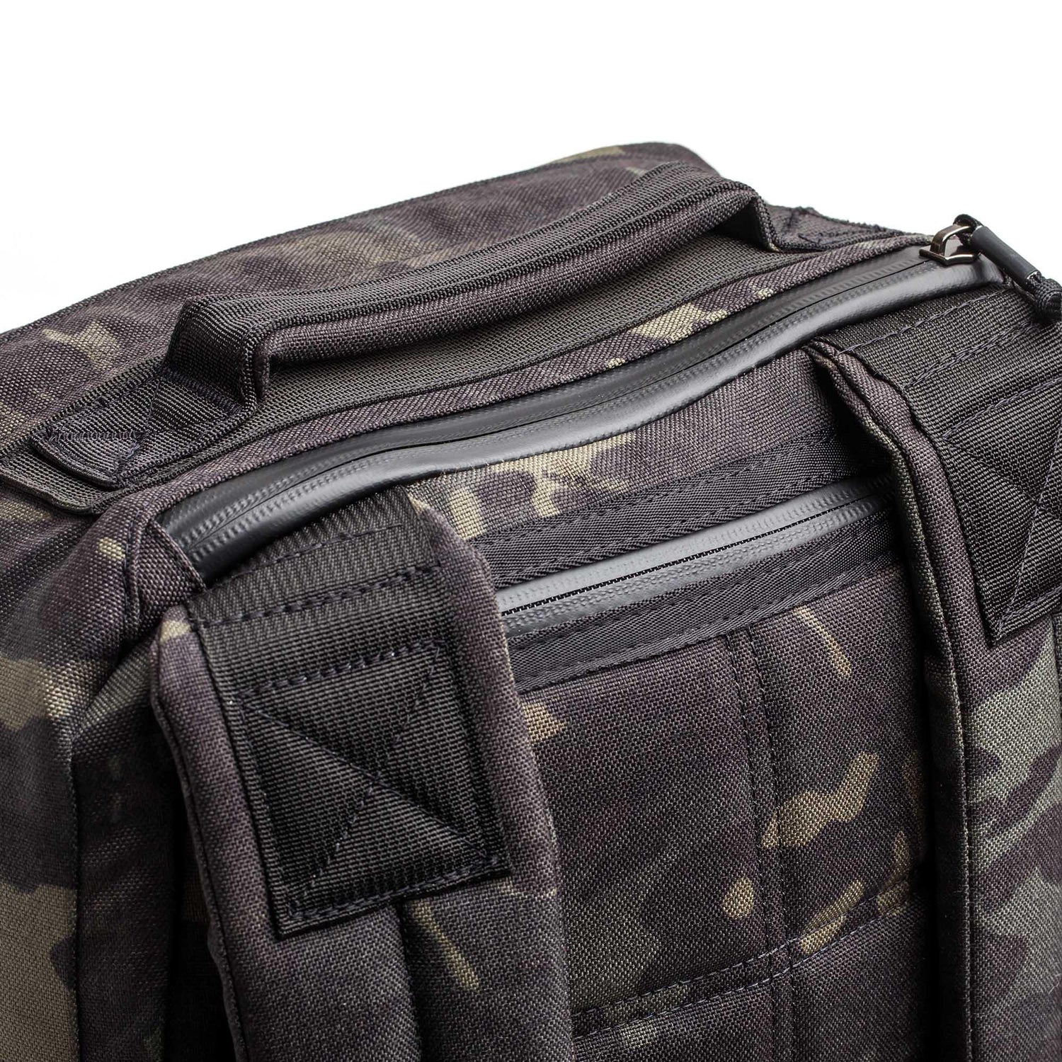 GORUCK black Multicam rucksack close-up showing durable handle and padded shoulder straps