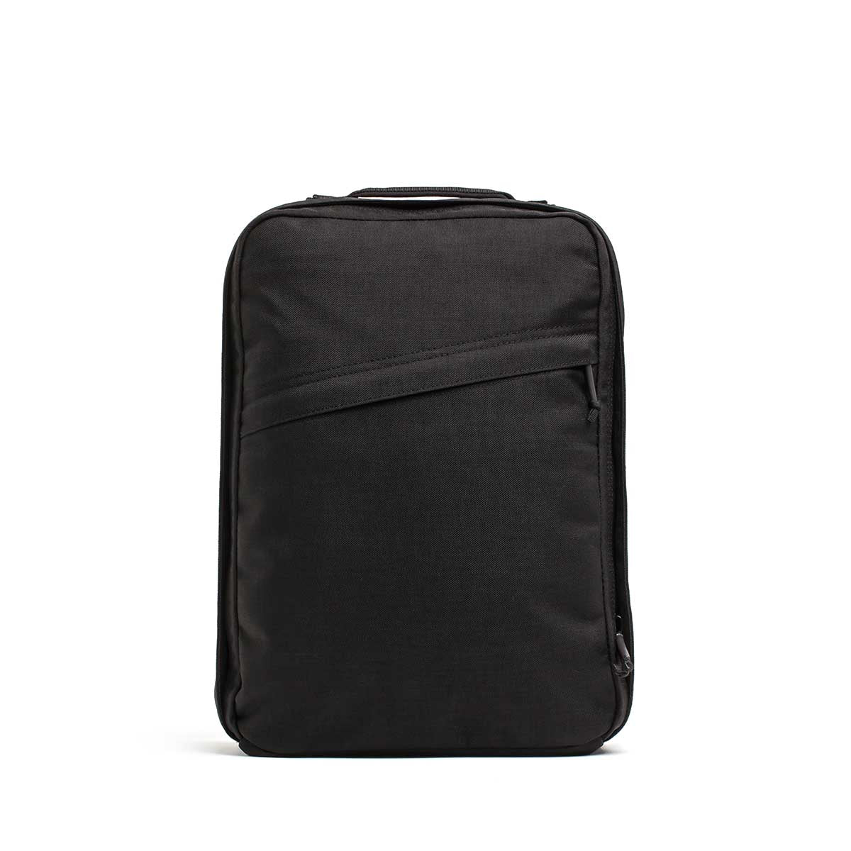 The GR0 USA Slick - Ballistic Nylon Cordura is a black rectangular backpack with a top handle, diagonal front zipper pocket, and bombproof laptop compartment, displayed on a white background.