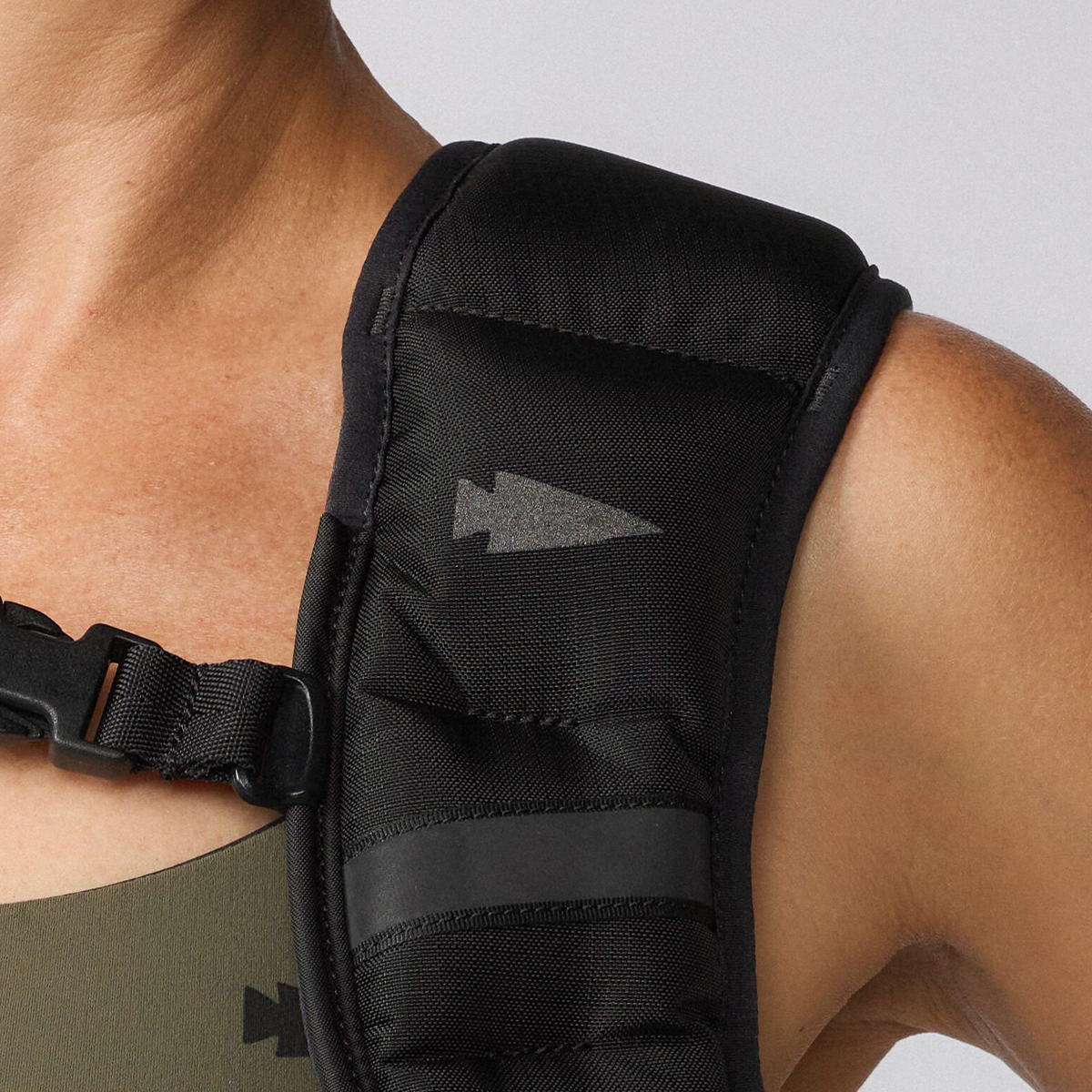 A person wearing a black strap.