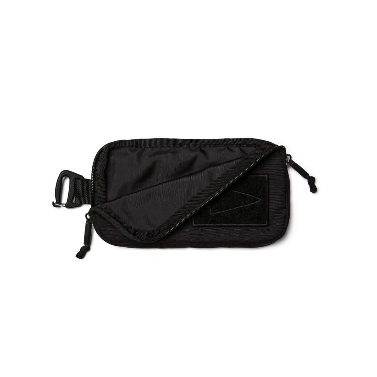 Black sternum strap pouch with zip and clip attachment, made from durable fabric, GORUCK gear