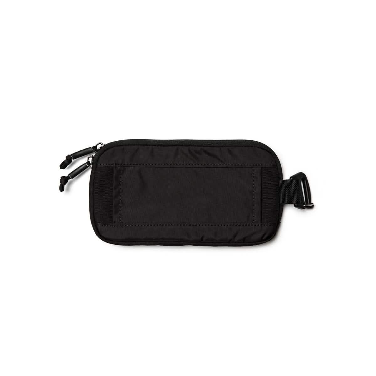 Black GORUCK sternum strap pouch made of durable fabric with double zipper and buckle attachment