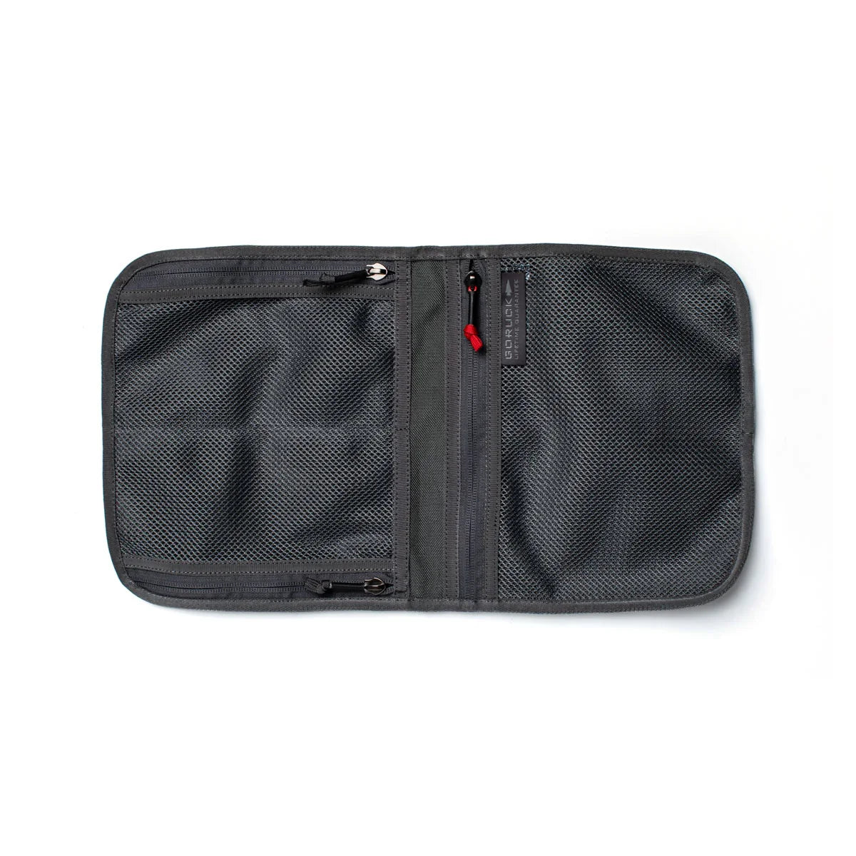 Open grey GORUCK Wire Dopp kit organizer with mesh zippered compartments on white background