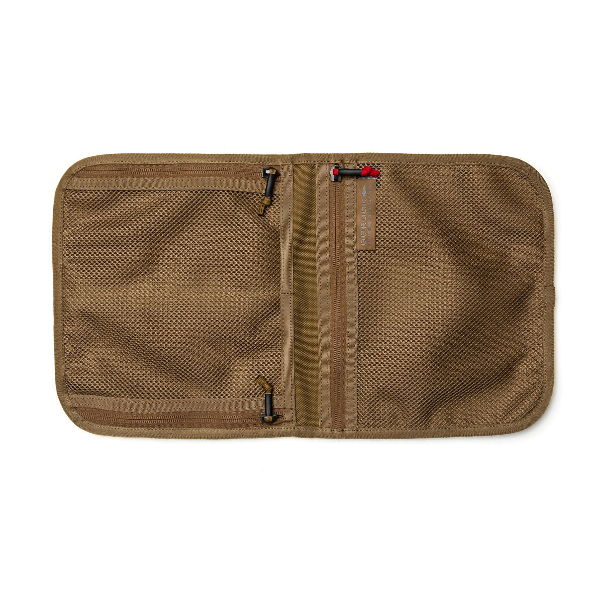 The Wire Dopp is an open tan mesh storage organizer with multiple zippered compartments, crafted from durable CORDURA—perfect for keeping your travel essentials organized.
