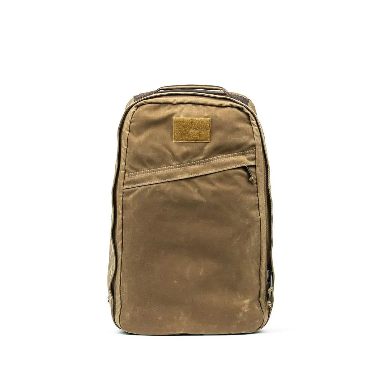 Field tan GORUCK 26-liter backpack with water-resistant fabric and diagonal zippered front pocket