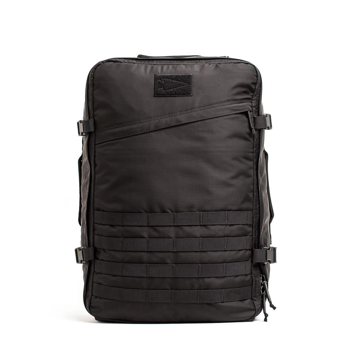 Black rugged GORUCK tactical backpack with modular rows and compression straps on white background