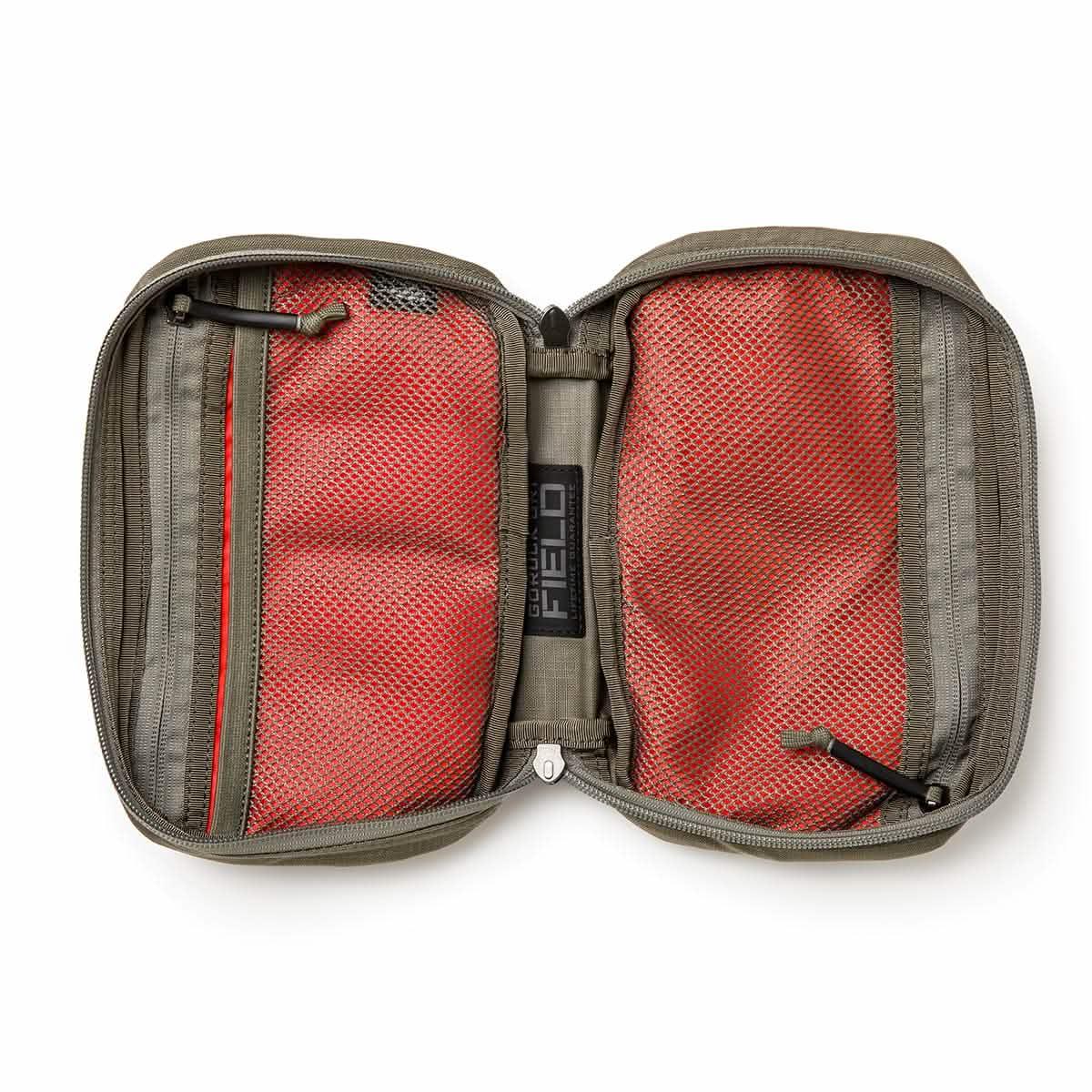 Open tactical organizer pouch with red mesh storage and gray ripstop fabric, GORUCK branding visible