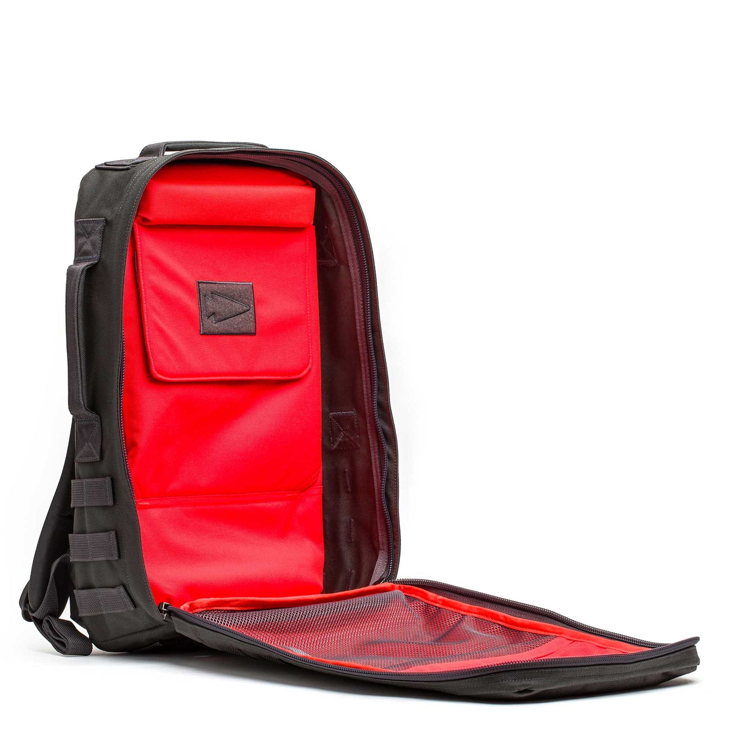 The Rucker 5.0 is a black rucksack backpack featuring a bright red interior with inner pockets and a mesh compartment—ideal for rucking or as your everyday backpack.