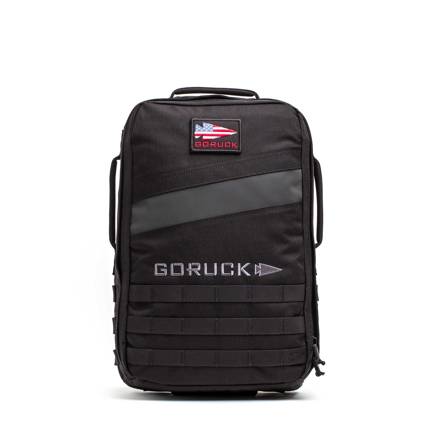The Rucker 5.0 is a black GORUCK rucksack featuring an American flag patch, front handles, MOLLE webbing on the lower front, and built-in lumbar support for comfortable rucking.