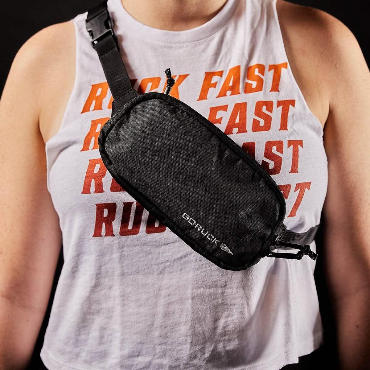 GORUCK black crossbody pouch worn over a rucking-themed tank top