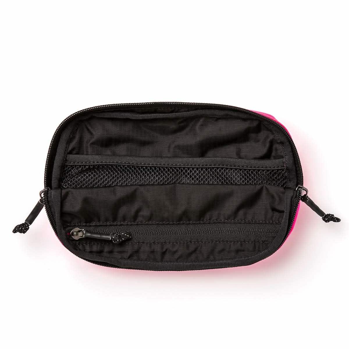 GORUCK large hot pink waist bag open, showing black interior mesh and zippered pockets