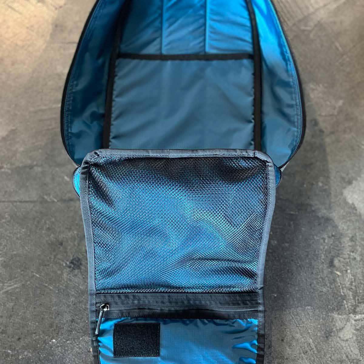 Open GORUCK rucksack showing spacious blue interior and mesh zippered pocket on lid