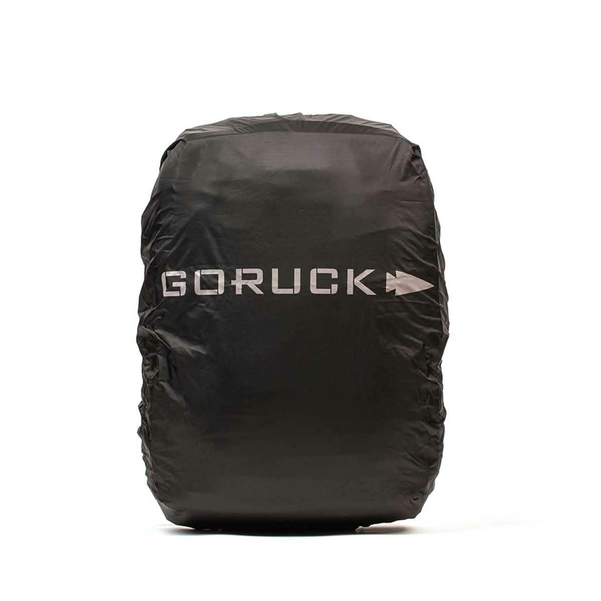 Black GORUCK backpack rain cover with reflective logo on white background