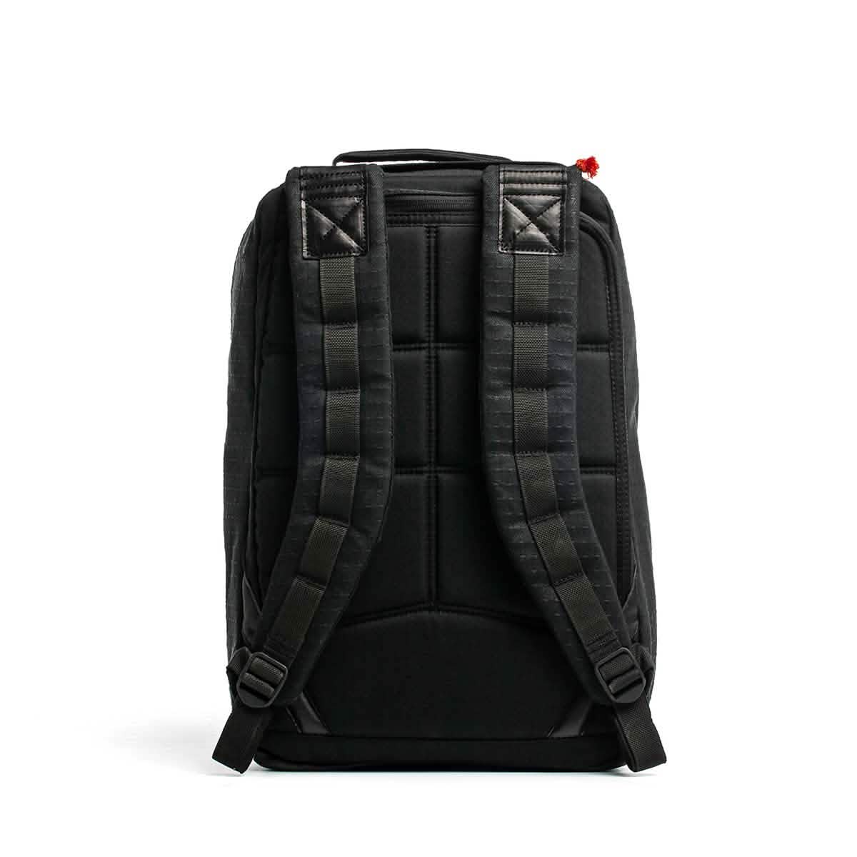Black backpack shown from the back, featuring padded shoulder straps and quilted stitching, crafted with premium Japanese cotton fabric from the GR1 USA x Carryology - GRXC2 Samurai collection.