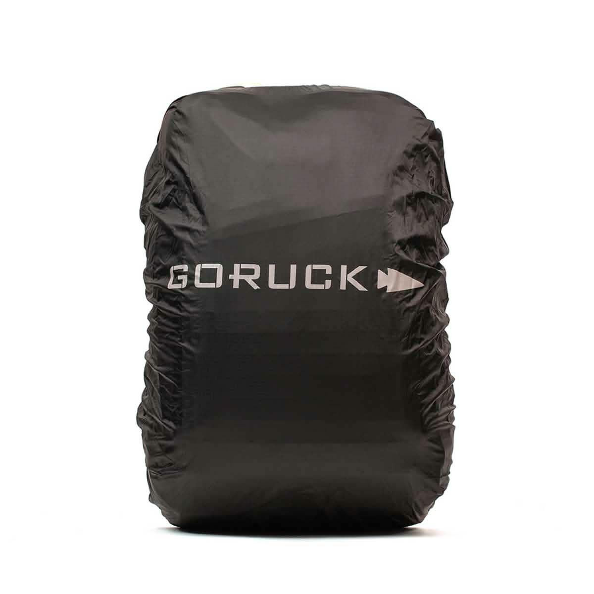 Black GORUCK rain cover for backpack with reflective logo against white background