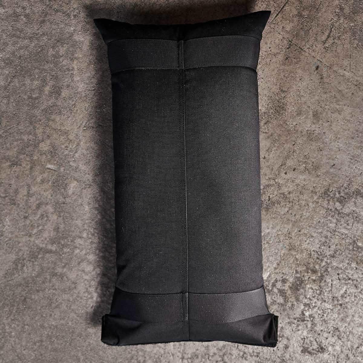 GORUCK black ruck sandbag filler on concrete floor, durable rucking gear for training