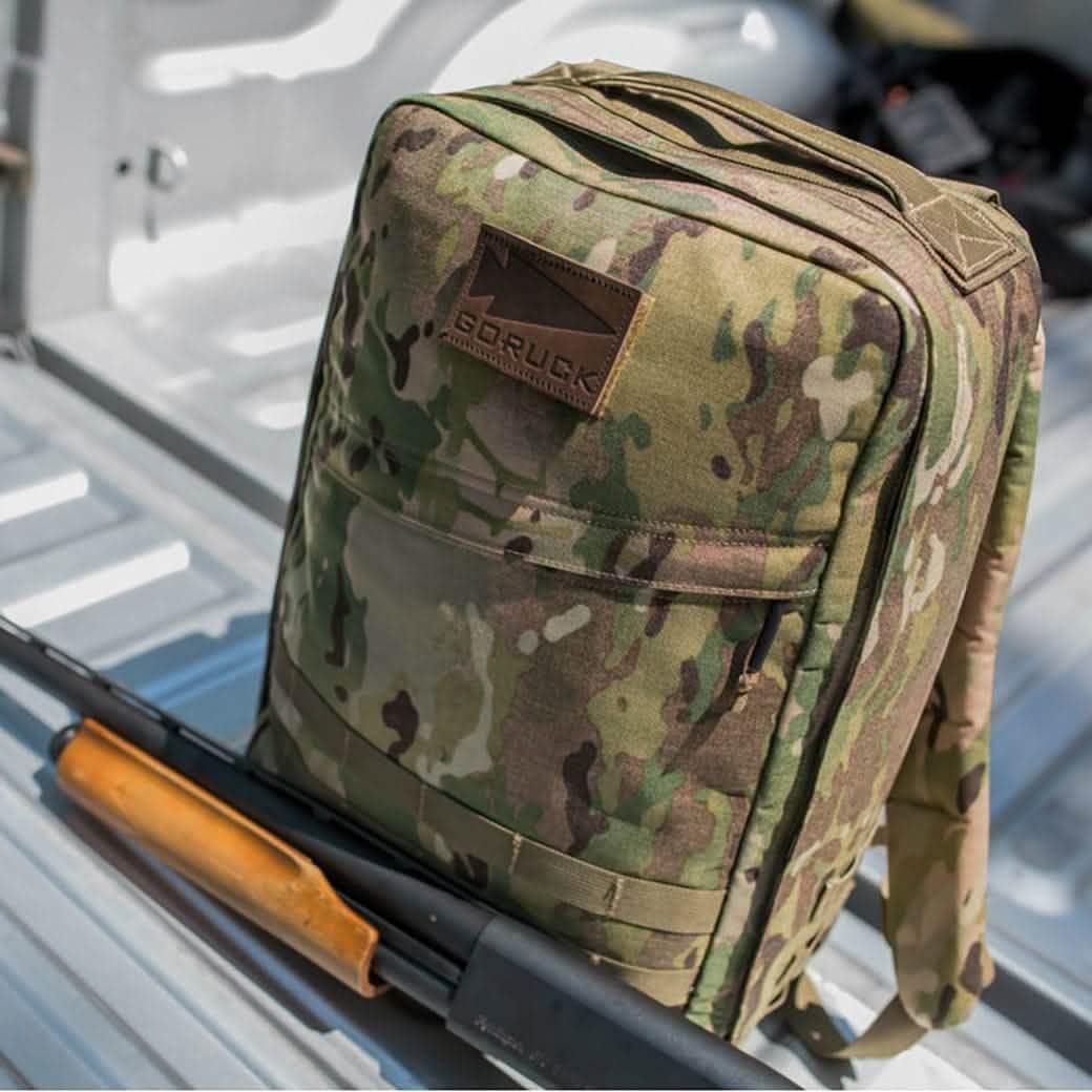 GORUCK camo rucksack backpack on truck bed, rugged outdoor rucking gear