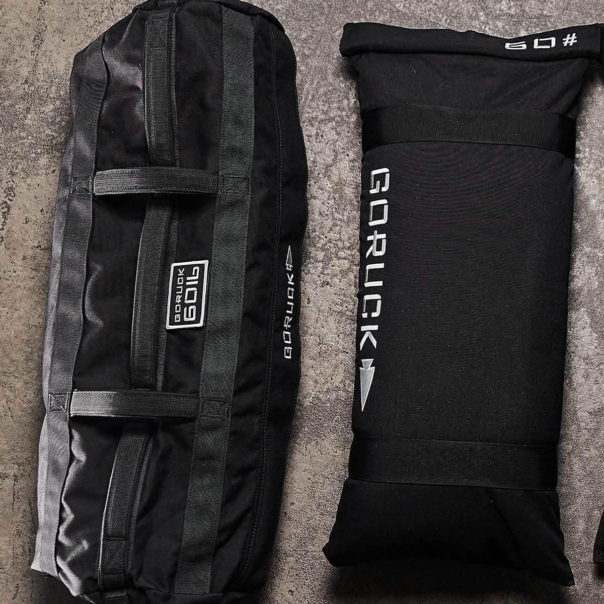 GORUCK 60lb sandbag and filler bag on concrete surface, rucking gear for training