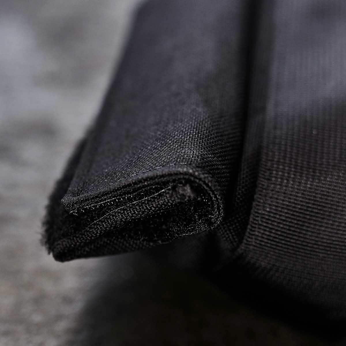 Close-up of black heavy-duty fabric edge with reinforced stitching, from GORUCK tough rucking gear