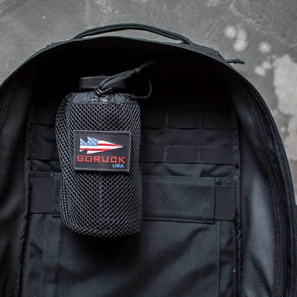 GORUCK mesh water bottle holder with USA patch inside black ruck backpack