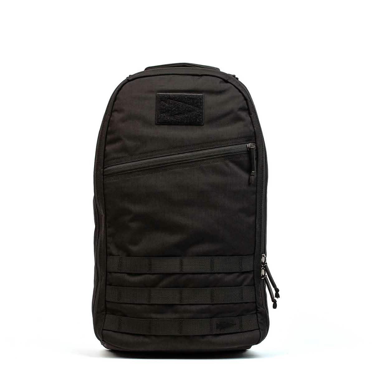 Black durable GORUCK rucksack with front diagonal zipper and MOLLE webbing, designed for tough outdoor use