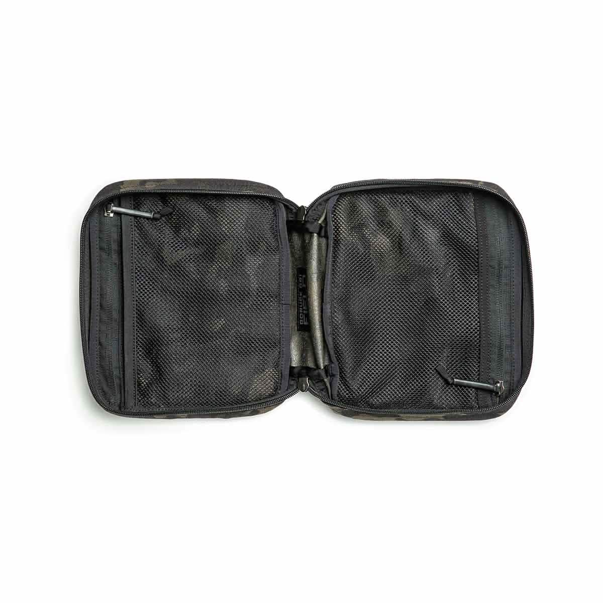 The GR2 Field Pocket - Black Multicam is an open black zippered pouch with mesh pockets on both sides, ideal as an electronics organizer, shown lying flat on a white background.