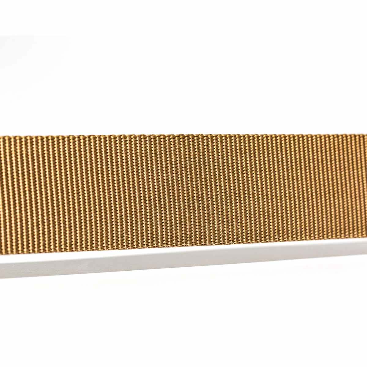 Close-up of a gold mesh metal strap displayed against a white background, resembling the intricate weave of a Spearhead Tactical Belt by Grip6. The strap showcases a detailed, woven pattern that exudes durability, making it perfect for endurance events.