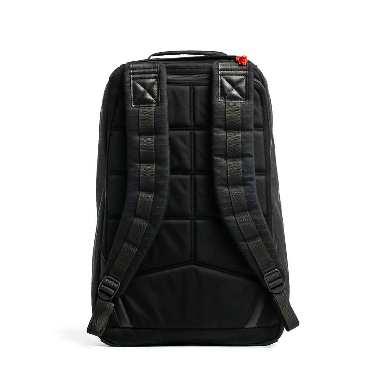 GR1 USA x Carryology - GRXC2 Samurai backpack shown from the back, featuring padded shoulder straps, Japanese cotton fabric accents, and a small red detail on the top right.