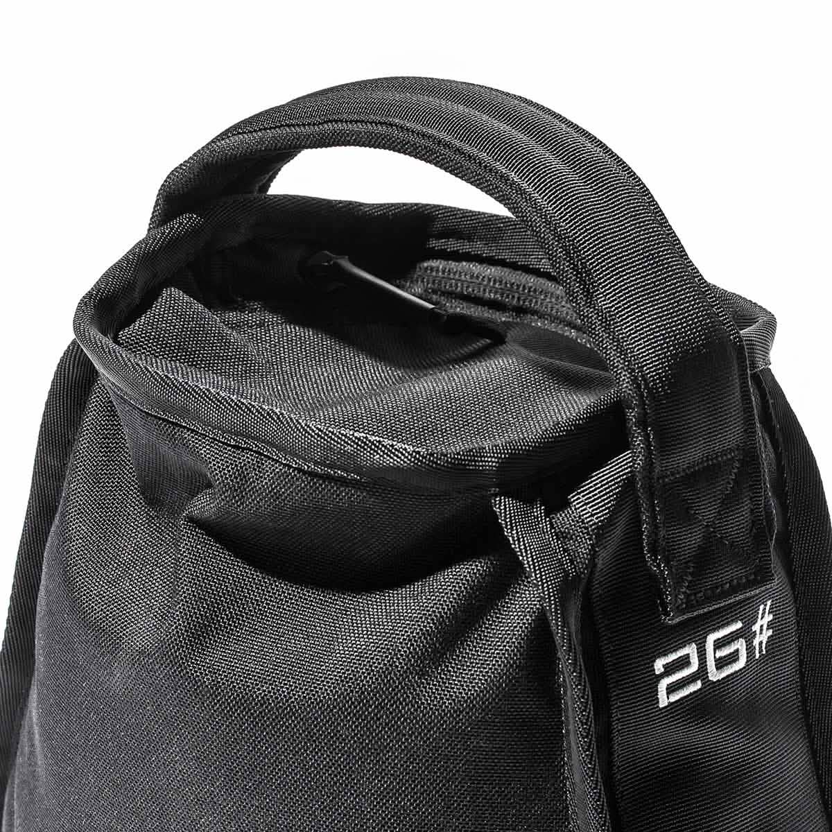Close-up of a black fabric bag with a soft handle and a visible zipper on top. The side of the bag features white text that reads 2G#. Its sturdy texture showcases the Endurance Design, ideal for those who appreciate both style and durability, by GORUCK's Sand Kettlebells collection.
