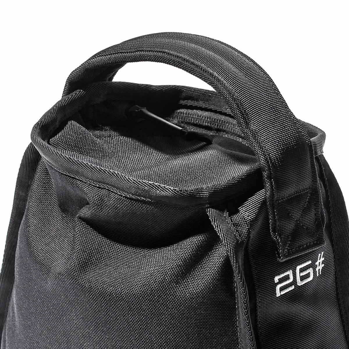Close-up of black GORUCK 2G# heavy-duty rucking sandbag with reinforced handle and sturdy zipper