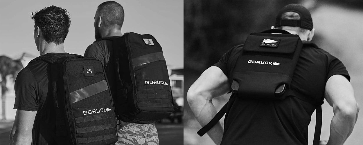 Two people with GORUCK backpacks walking.