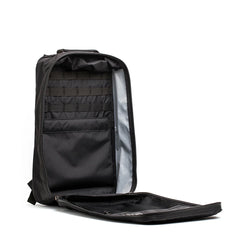 Black GORUCK backpack opened fully to show organized interior compartments and zippered pockets
